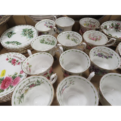 69 - A tray of Royal Albert 'Flowers of the Month' trios together with a tray of Wedgwood calendar plates