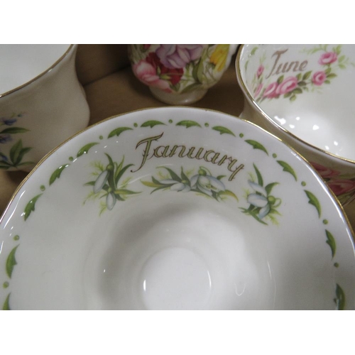 69 - A tray of Royal Albert 'Flowers of the Month' trios together with a tray of Wedgwood calendar plates