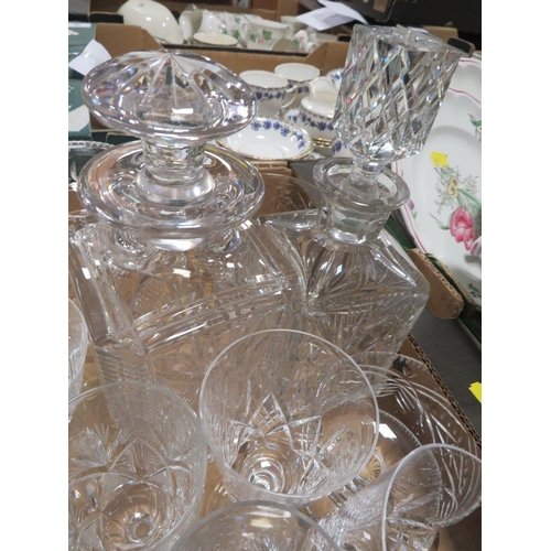 74 - Two trays of assorted cut glass to include decanters etc