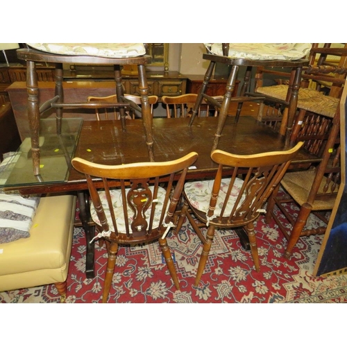 787 - An oak refectory dining table with four chairs, and two other wheel back chairs A/F