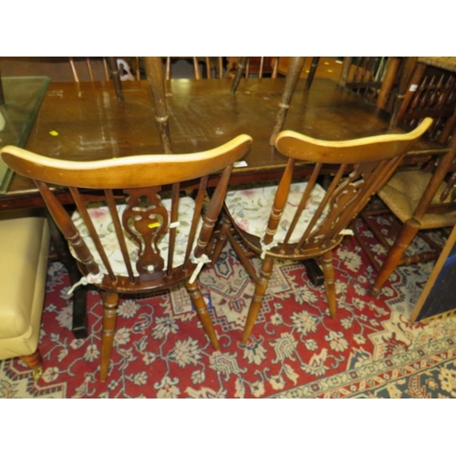 787 - An oak refectory dining table with four chairs, and two other wheel back chairs A/F