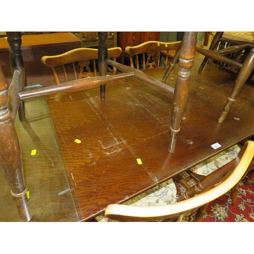 787 - An oak refectory dining table with four chairs, and two other wheel back chairs A/F