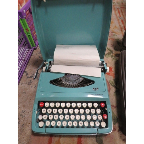 91 - A vintage Smith Corona portable typewriter together with a smaller example