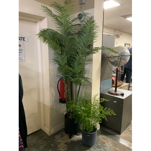 842 - A large artificial palm style plant and a smaller example