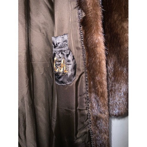 46 - A vintage rich mahogany brown mink fur three-quarter length coat, fully lined with embroidered embel... 