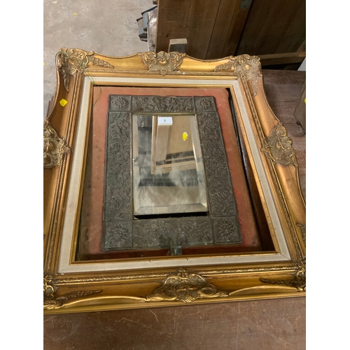 3 - An antique Eastern framed mirror together with a modern gilt frame and an oak framed mirror