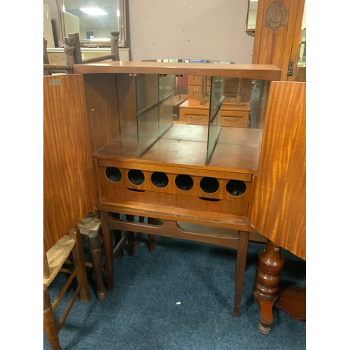 778 - A mid-century Timeless Trend teak drinks cabinet on stand H 127 cm W 84 cm