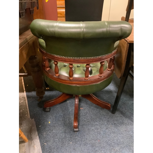 789 - A green leather swivel office tub chair