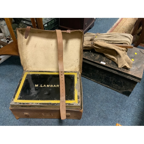 816 - A vintage leather cased tin trunk named M Lambart together with another tin trunk, etc.