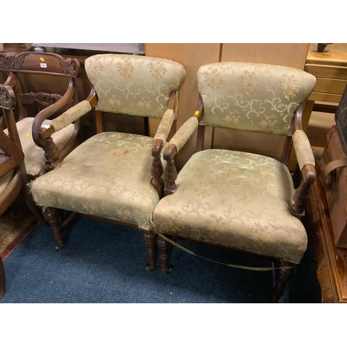 817 - A pair of Edwardian oak upholstered armchairs