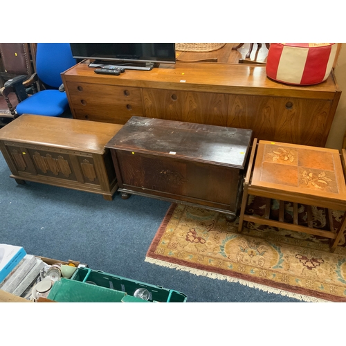 823 - A reproduction oak linen fold blanket box together with another vintage blanket box and a mid-centur... 