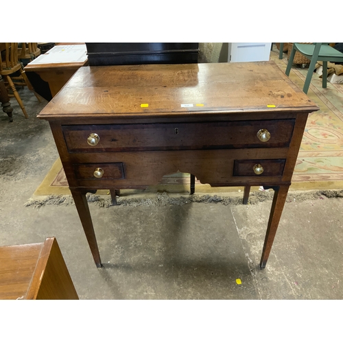 835 - A Georgian oak and mahogany crossbanded lowboy