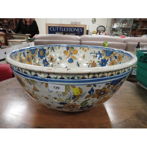 129 - A large Continental Faience style pottery bowl approx Dia. 47cm, A/F