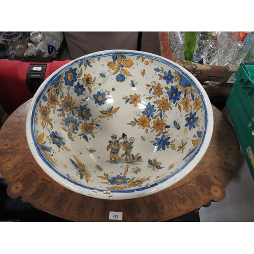 129 - A large Continental Faience style pottery bowl approx Dia. 47cm, A/F