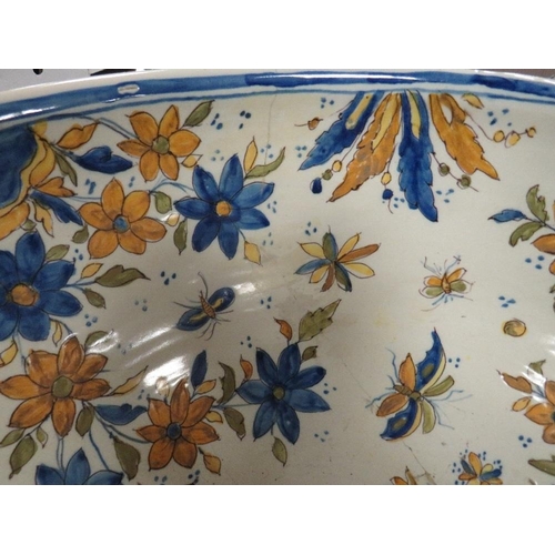 129 - A large Continental Faience style pottery bowl approx Dia. 47cm, A/F