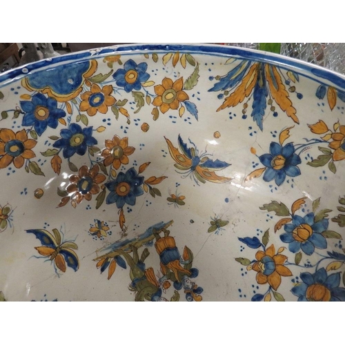 129 - A large Continental Faience style pottery bowl approx Dia. 47cm, A/F