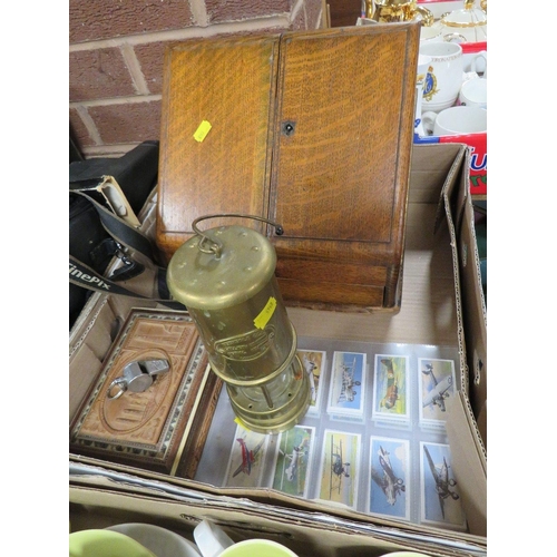 153 - A tray of collectables to include a miners lamp, vintage whistle and stationary box etc