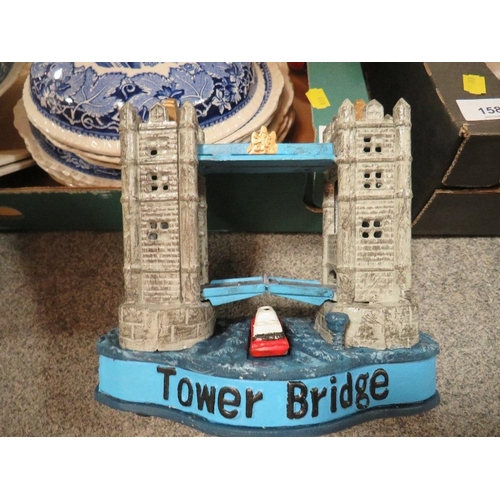 157 - Two trays of ceramics and glass to include a metal model of Tower Bridge London, a pair of Staffords... 