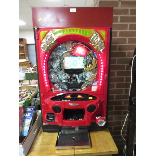 53 - A vertical Japanese pinball machine with video display