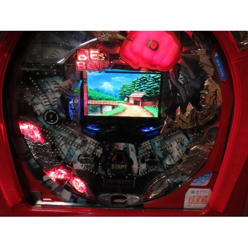 53 - A vertical Japanese pinball machine with video display