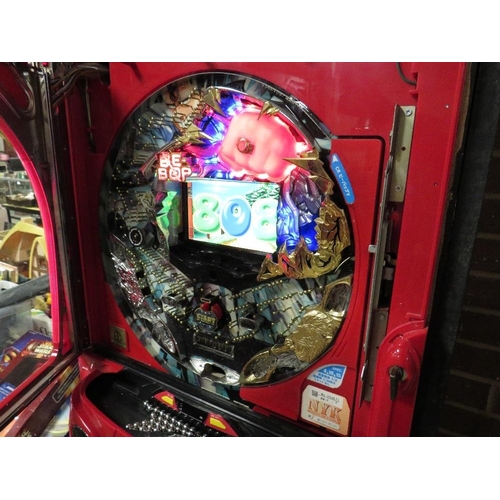 53 - A vertical Japanese pinball machine with video display