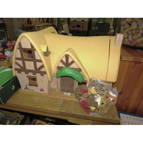 62 - A vintage Disney Snow White and the Seven Dwarfs cottage with figures and furniture