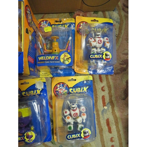 65 - A tray of assorted packaged Cubix figures