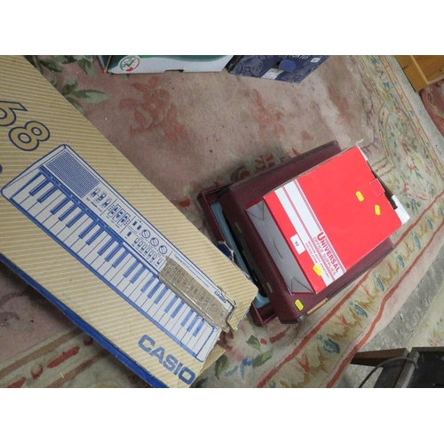 92 - A Casio keyboard, vintage typewriter, calculator etc