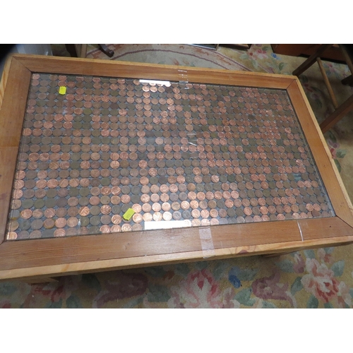 833 - A penny decorated coffee table