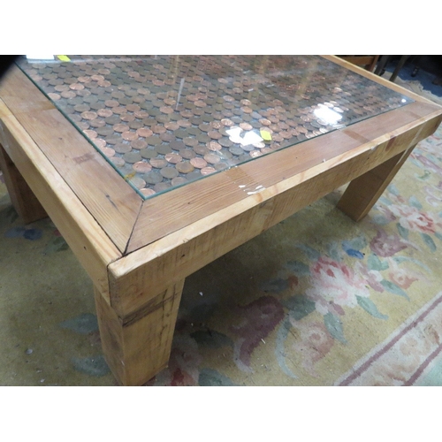 833 - A penny decorated coffee table