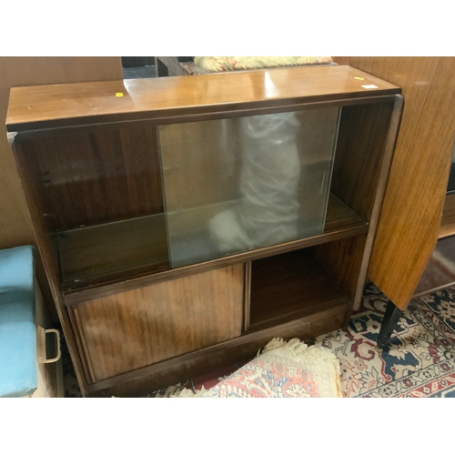 861 - A vintage teak, sliding door bookcase