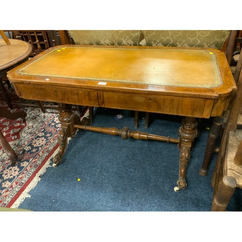 875 - A Victorian walnut and inlaid two drawer leather top library table with nicely carved supports and s... 