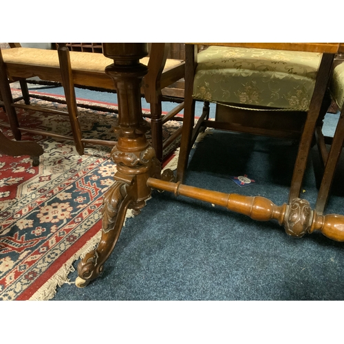 875 - A Victorian walnut and inlaid two drawer leather top library table with nicely carved supports and s... 