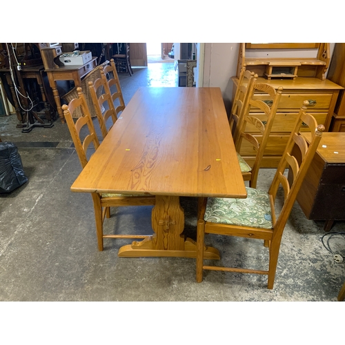 887 - A pine Ercol refectory table and six chairs