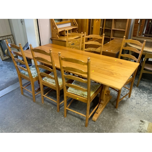 887 - A pine Ercol refectory table and six chairs