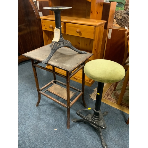 891 - A vintage bamboo table together with a lightweight cast stool and stool base