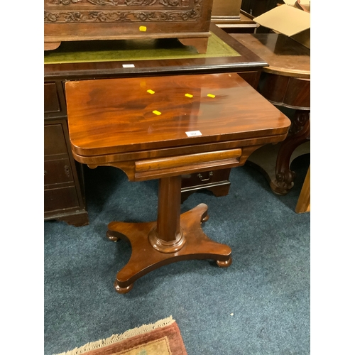 902 - A Georgian mahogany fold over games table of small proportions W 60 cm