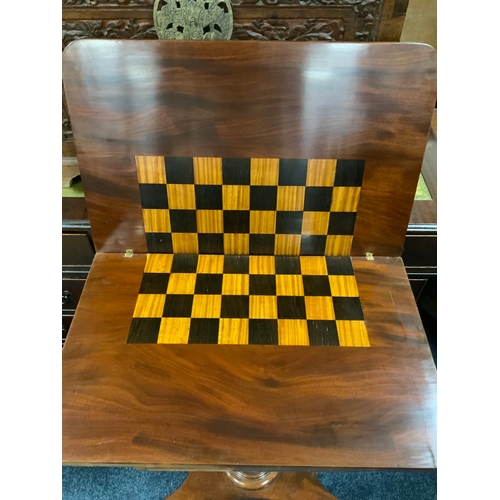 902 - A Georgian mahogany fold over games table of small proportions W 60 cm