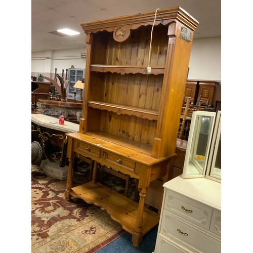 909 - A honey pine carved open kitchen dresser W 114 cm