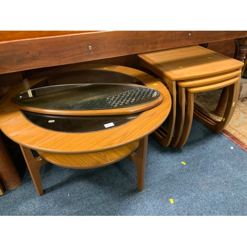 911 - A mid-century teak circular glass top table together with a mid-century mirror and nest of tables