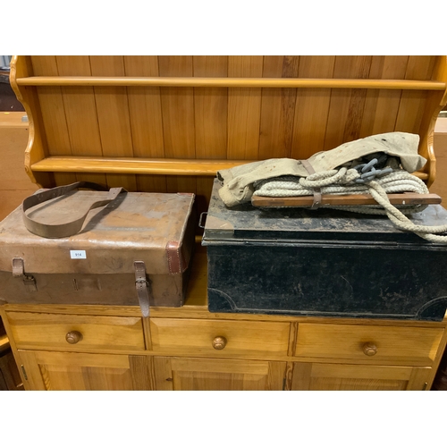 914 - A vintage leather covered tin trunk addressed to M Lambart together with another tin trunk etc.