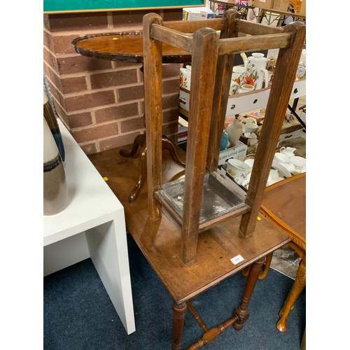 918 - An Edwardian occasional table together with a walnut pedestal table and an oak stick stand