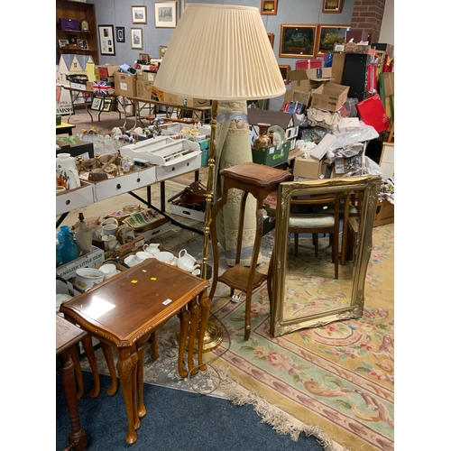 919 - An oak plant stand with a brass effect standard lamp, gilt mirror and nest of tables