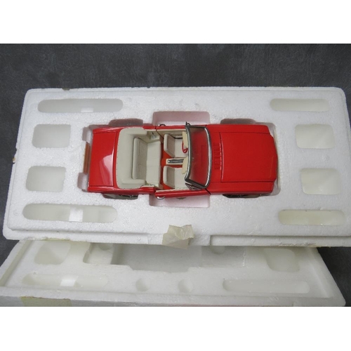 123 - A BOXED FRANKLIN MINT FORD THUNDERBIRD, together with four unboxed 1:18 cars to include Maitso Citro... 