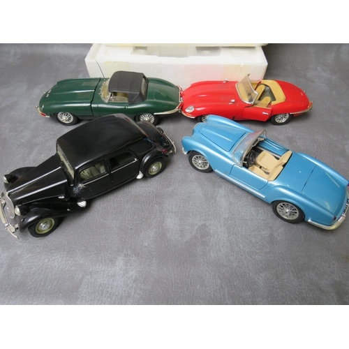 123 - A BOXED FRANKLIN MINT FORD THUNDERBIRD, together with four unboxed 1:18 cars to include Maitso Citro... 