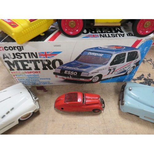 133 - THREE UNBOXED TIN PLATE CARS, to include JNF Duplex with key, Schuco Kommando Anno 200 and another, ... 