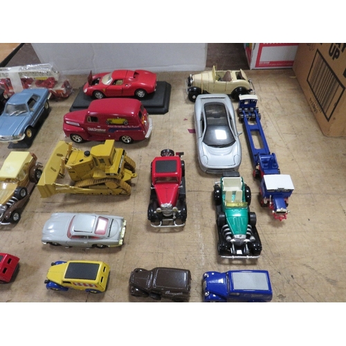 134 - NINETEEN UNBOXED DIE CAST VEHICLES, to include Liberty 1948 Ford, ERTL Dyersville earth mover, Corgi... 