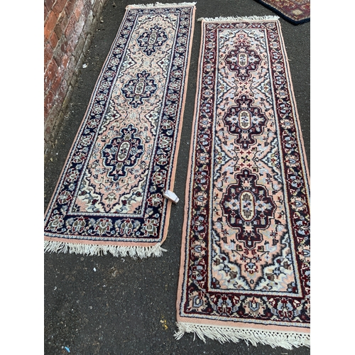 927 - Two Indian woollen runner rugs 213 x 69 cm