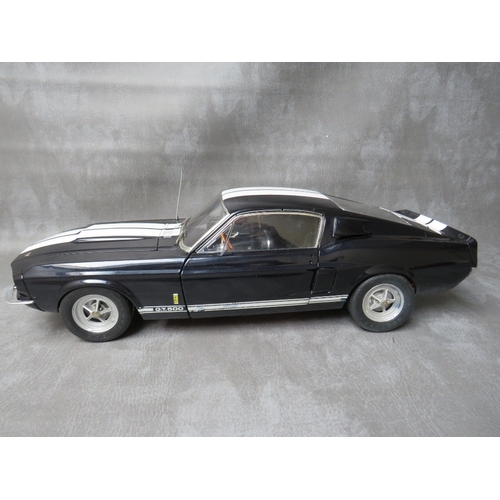 85 - A DE AGOSTINI 1:8 SCALE DIE CAST MODEL OF A FORD MUSTANG 1967 SHELBY GT500, on a mahogany wooden sta... 