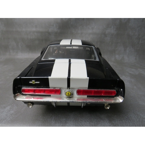 85 - A DE AGOSTINI 1:8 SCALE DIE CAST MODEL OF A FORD MUSTANG 1967 SHELBY GT500, on a mahogany wooden sta... 